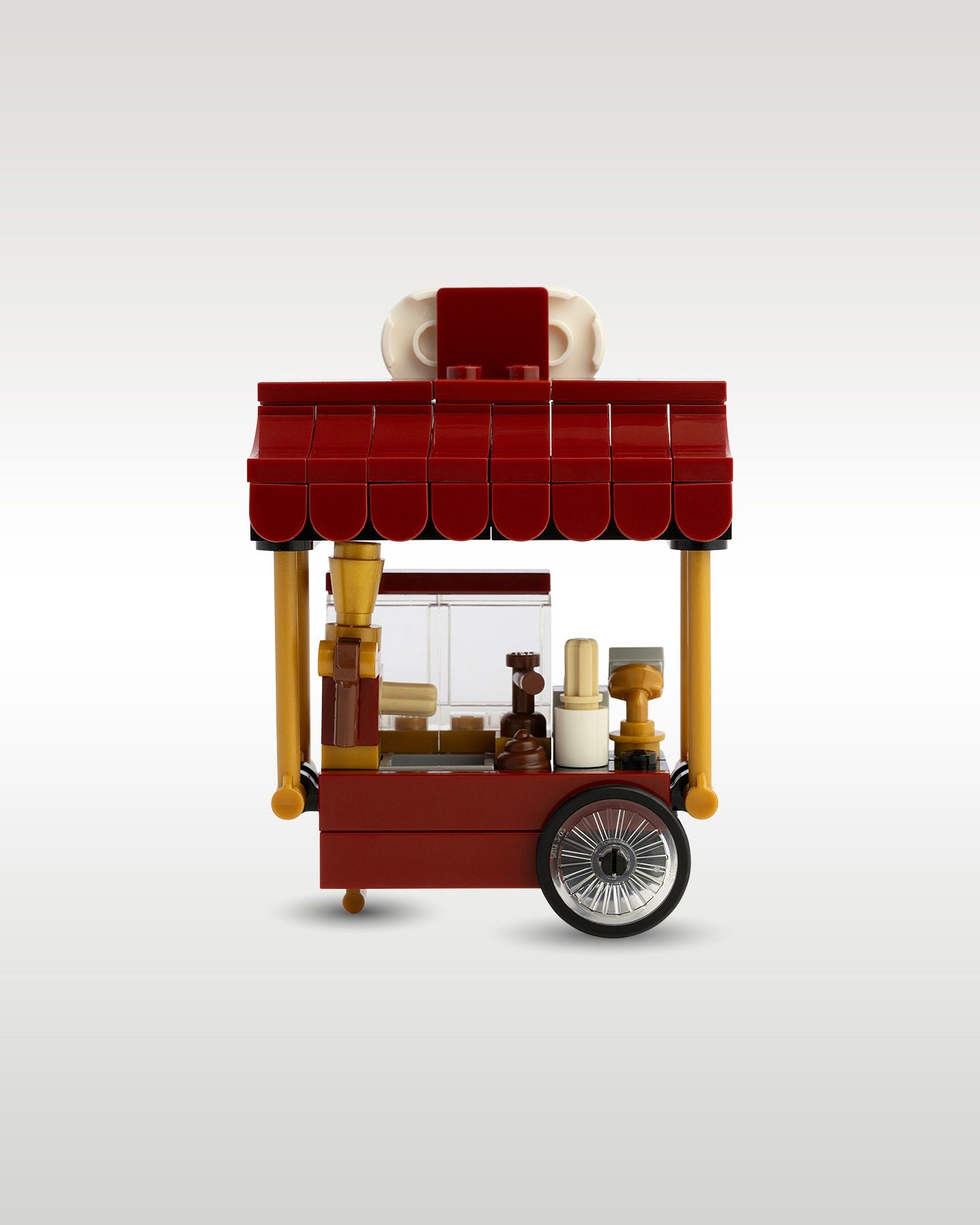 Rear view of the custom churro food cart showing the vendor's side workspace, equipped with a cash register terminal and storage space for freshly baked churros