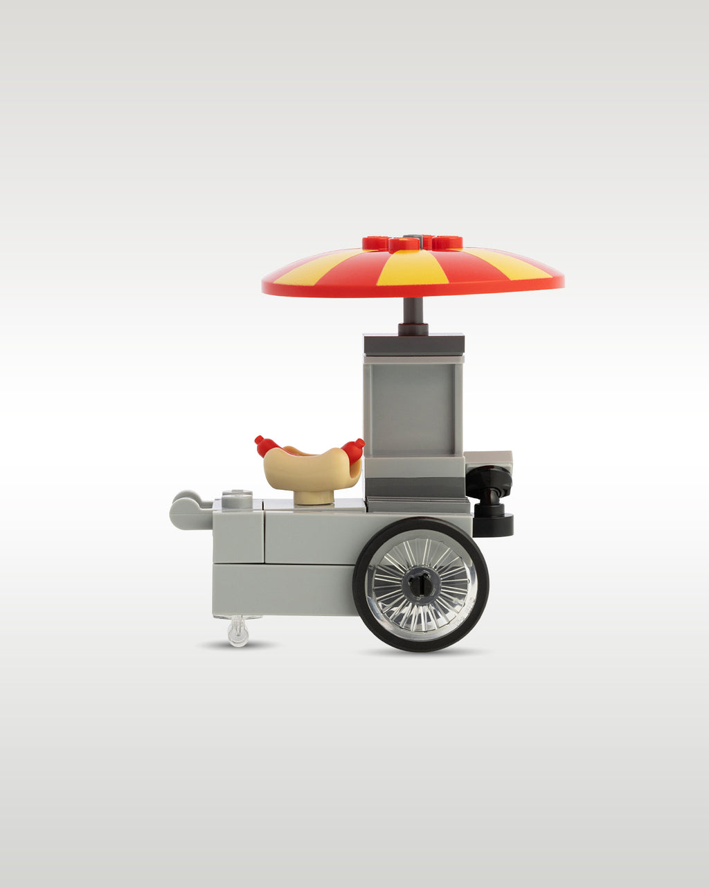 Rear view of the custom hot dog food cart showing the vendor push handles and sleek grey chassis paneling