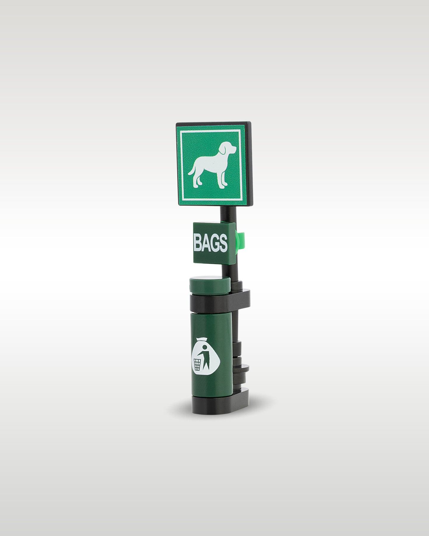 Side perspective view of the Trader Bricks custom MOC city park dog waste signpost, demonstrating the compact micro-scale designed to attach seamlessly to custom brick sidewalks