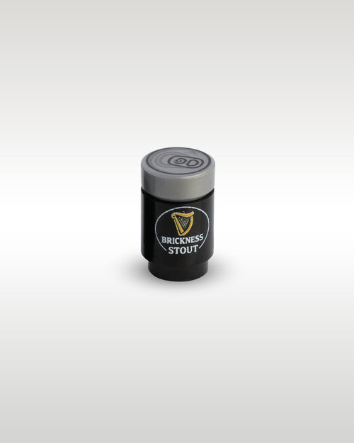 High-angle perspective of the black Brickness Stout custom toy brick can by Trader Bricks, highlighting the detailed silver pull-tab printed top lid