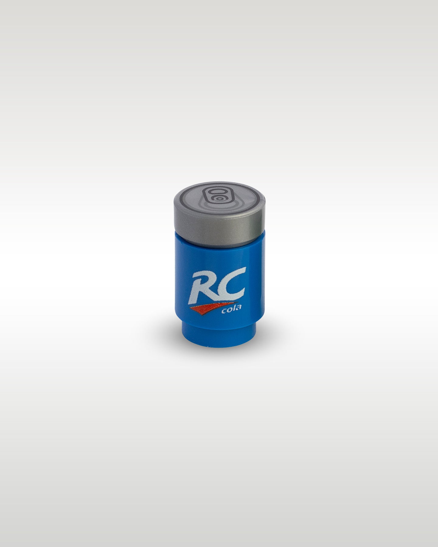 High-angle perspective of the blue RC Cola custom toy brick can by Trader Bricks, highlighting the detailed silver soda can pull-tab printed top lid