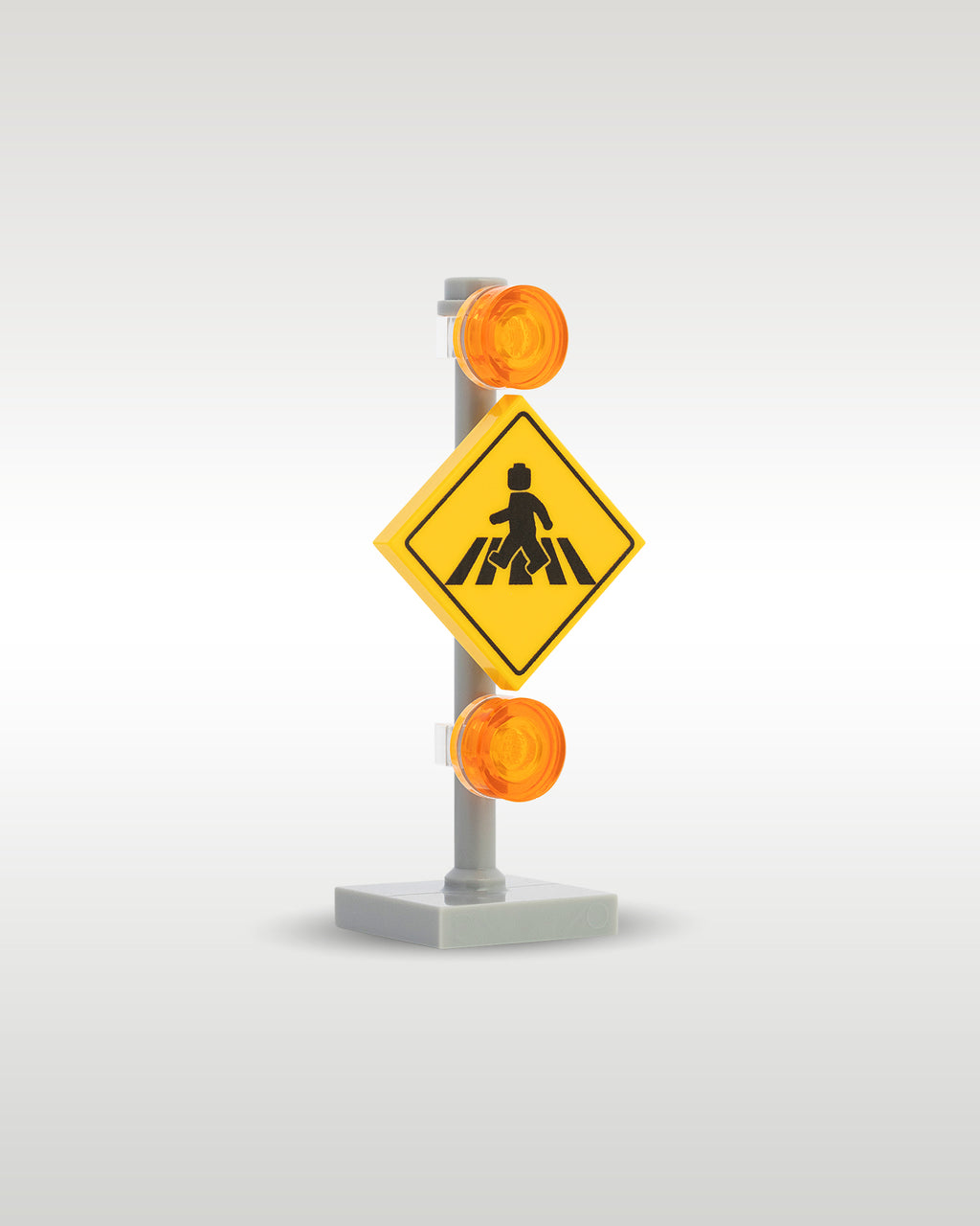 Custom brick-built yellow crosswalk road sign model by Trader Bricks, featuring a custom printed diamond pedestrian crossing tile and translucent orange flashing warning beacons