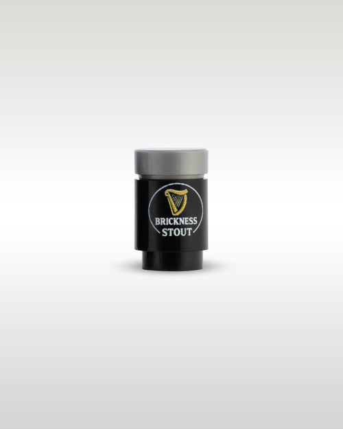 Custom printed Brickness Stout beer can accessory by Trader Bricks, featuring a gold harp parody logo on a black 1x1 round brick for Lego minifigures