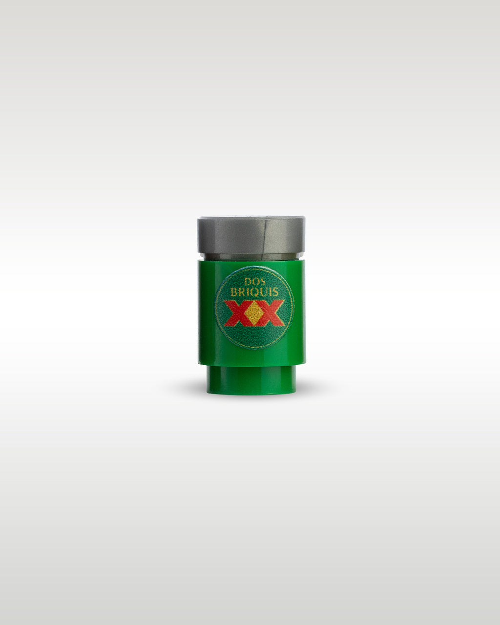 Custom printed Dos Briquis beer can accessory by Trader Bricks, featuring a red XX parody logo on a green 1x1 round brick for Lego minifigures