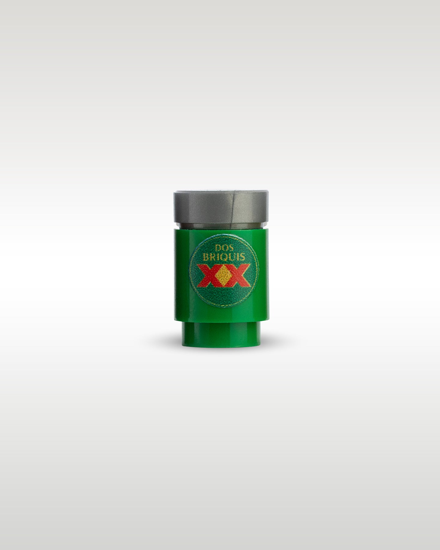 Custom printed Dos Briquis beer can accessory by Trader Bricks, featuring a red XX parody logo on a green 1x1 round brick for Lego minifigures