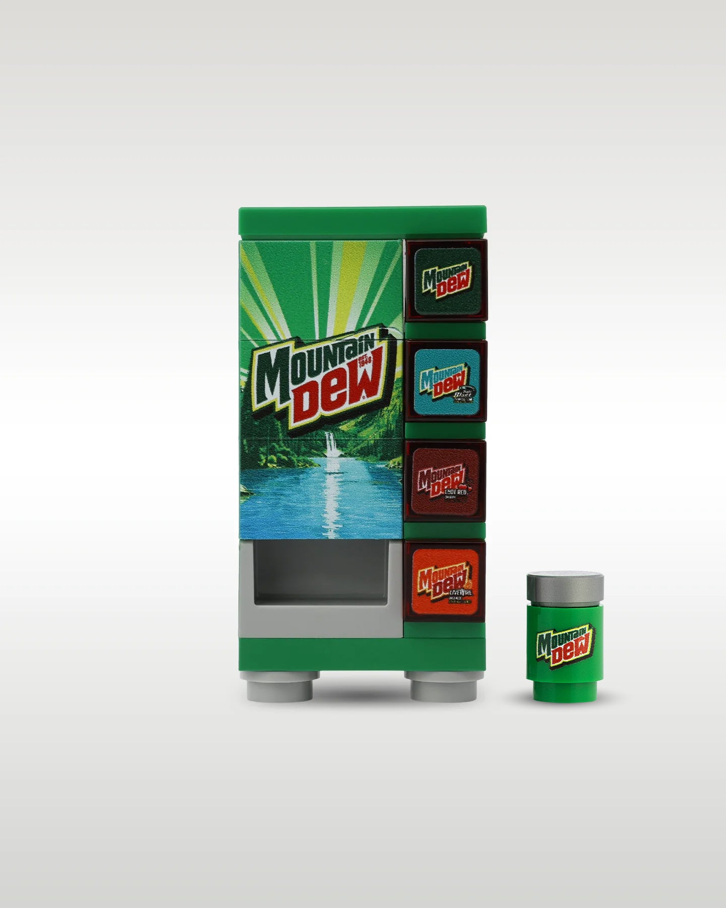 Custom brick-built Mountain Dew soda vending machine MOC set by Trader Bricks, featuring a vibrant green mountain landscape graphic panel and a matching miniature soda can accessory