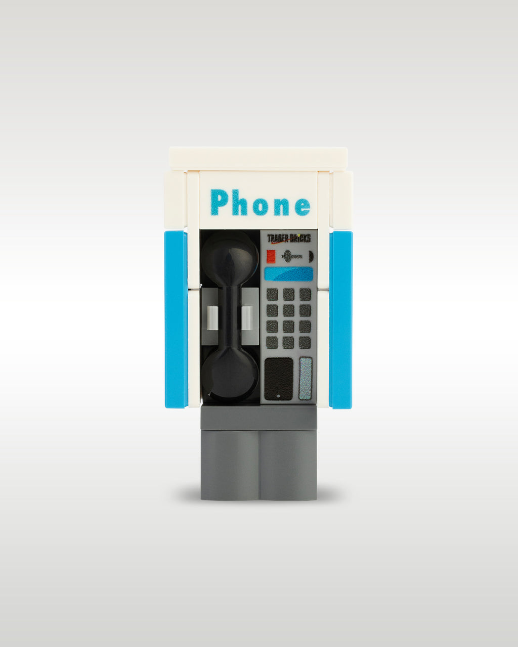 Custom brick-built public phone booth payphone MOC model by Trader Bricks, featuring a custom printed blue and white enclosure with a realistic black telephone handset