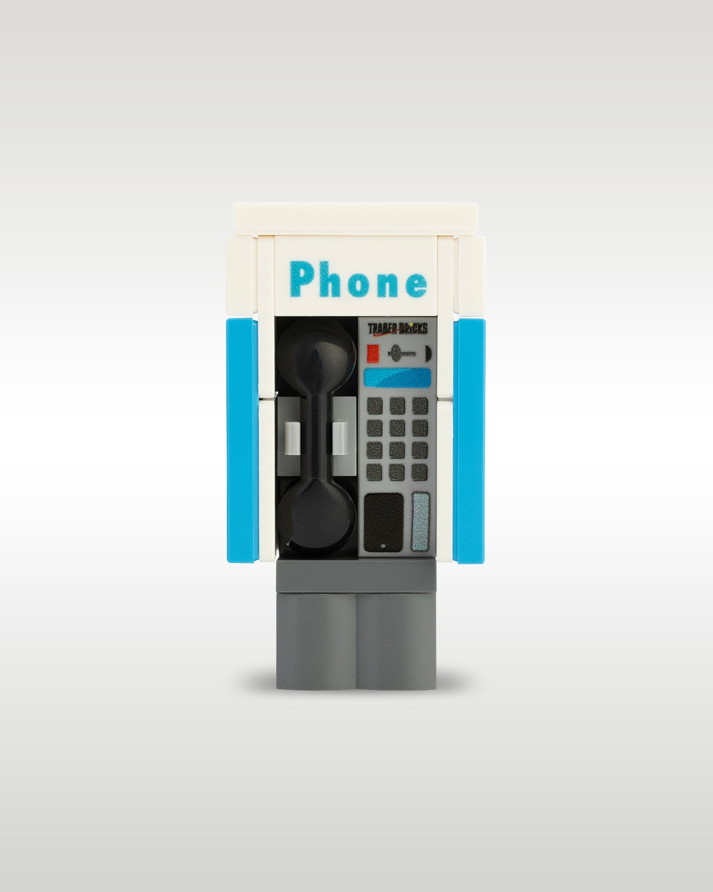 Custom brick-built public phone booth payphone MOC model by Trader Bricks, featuring a custom printed blue and white enclosure with a realistic black telephone handset