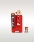 Custom brick-built vintage cola vending machine MOC set by Trader Bricks, featuring a 1950s-style red and white rounded design with a matching miniature soda bottle accessory