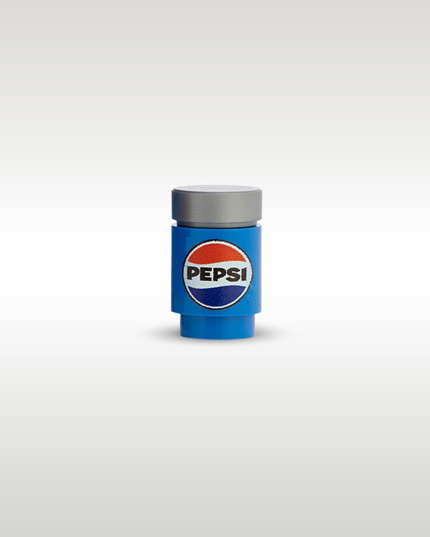 Front close-up view of the custom printed miniature Pepsi soda can accessory by Trader Bricks, featuring the classic logo on a 1x1 blue round brick