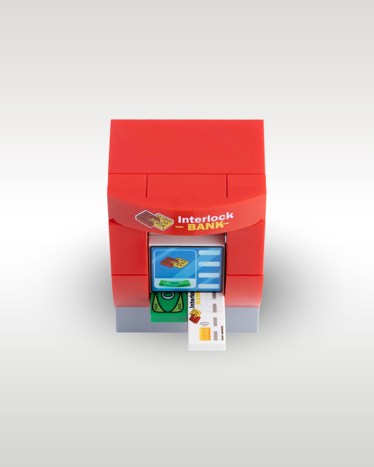 Top-down view of the working custom Lego compatible ATM by Trader Bricks, showing a micro-scale credit card being inserted into the functional machine